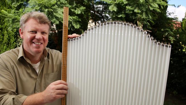 Jan Cleveringa uses fluorescent light tubes to create headstones. Picture: Peter Kelly