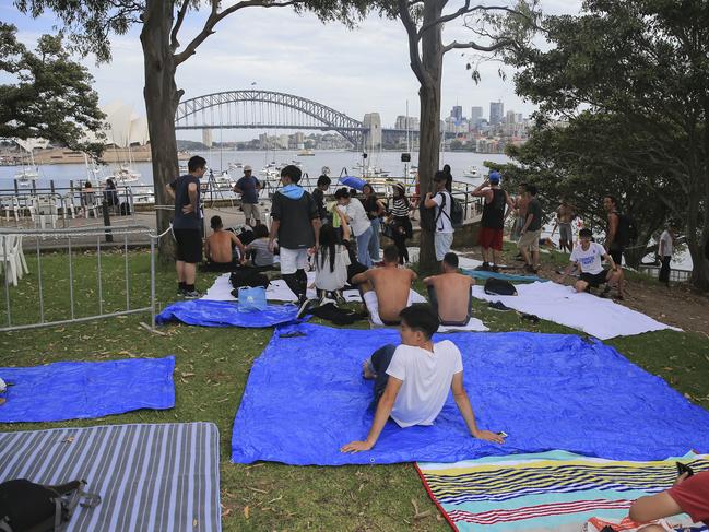 Crowds flock into Mrs Macquarie's Chair to claim positions for tonight's New Years Eve celebrations in Sydney. Picture: Dylan Robinson