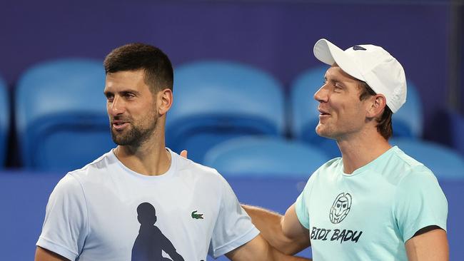 Matt Ebden of Team Australia (R) talks with Novak Djokovic of Team Serbia during a practice session ahead of the 2024 United Cup at RAC Arena in Perth in December.