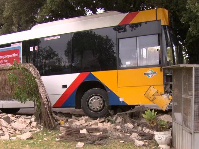 School children onboard a bus have had a lucky escape after it ploughed through the front fence of a Glenelg South home., The bus clipped a roundabout and a car before crashing on busy Moseley Street. Picture: 7News Adelaide