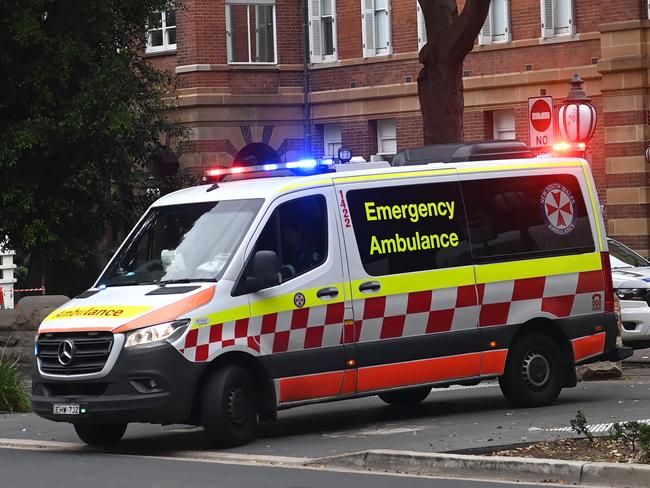 SYDNEY, AUSTRALIA -TelegraphMarch 21, 2022: An ambulance leaves the RPA Hospital as paramedics begin industrial action . Picture:  Jeremy Piper