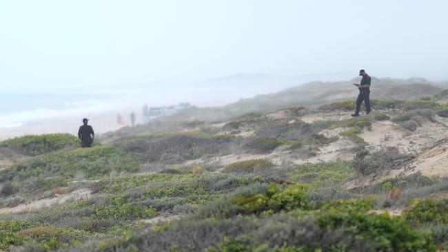 Police and SES officers searching the area around the Salt Creek campsite last year.