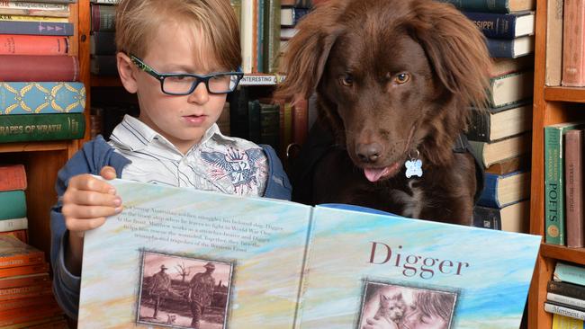 Sarah MacDonald’s dog Oscar helps Ryan with his reading. Picture: Lawrence Pinder