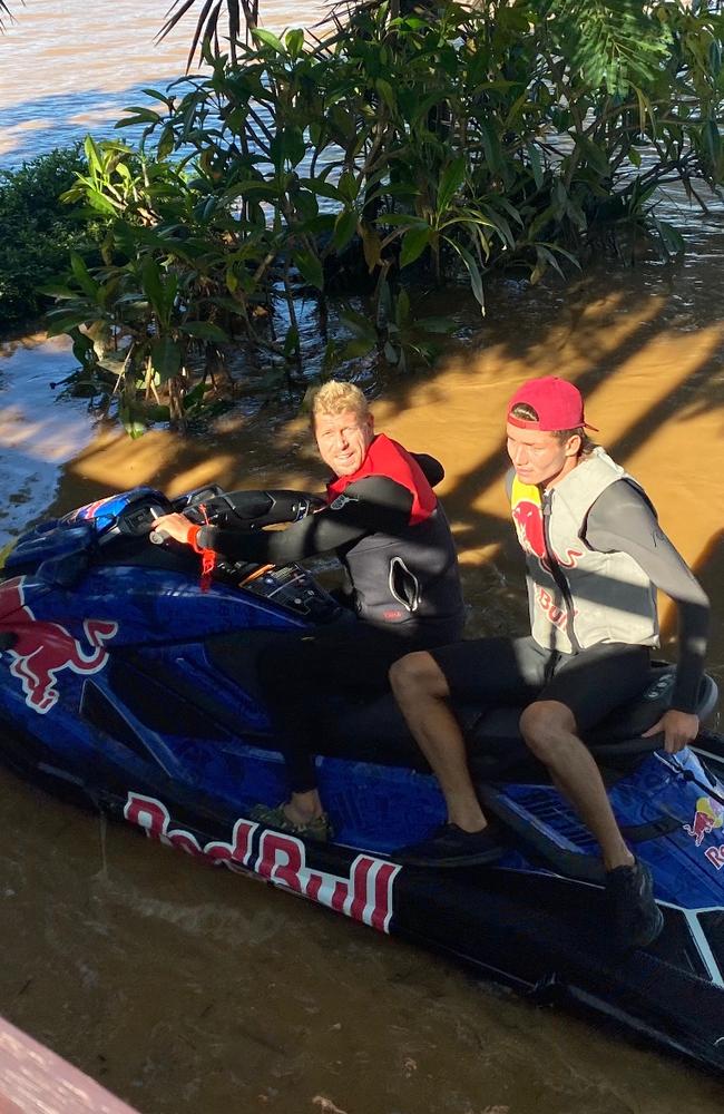 Surfing legends Joel Parkinson and Mick Fanning have been spotted rescuing flood victims in northern NSW.