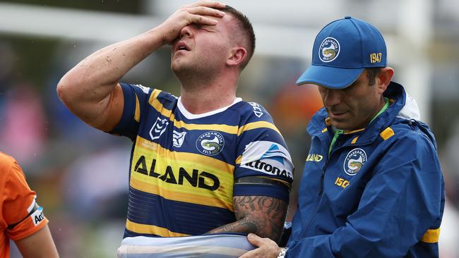 Eels forward Nathan Brown is assisted from the field. Picture: Getty Images