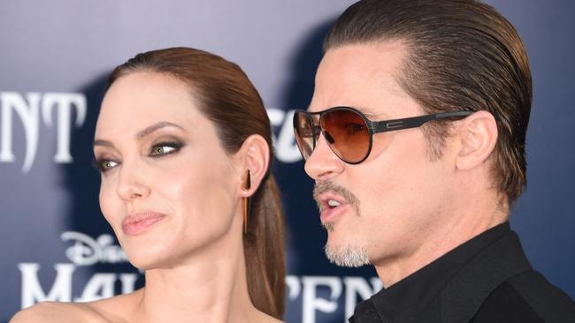 Happier times: Angelina and Brad on a 2014 red carpet. Picture: Robyn Beck/AFP