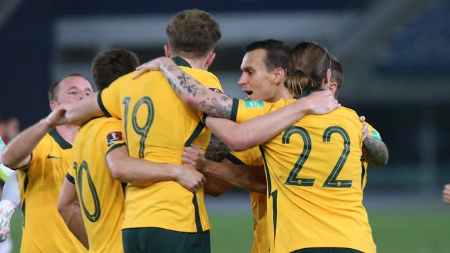 Australia's Harry Souttar (19) celebrates his goal with his teammates during the 2022 FIFA World Cup qualification group B football match between Australia and Jordan at the Kuwait Sports Club in Kuwait City on June 15, 2021. (Photo by Yasser Al-Zayyat / AFP)