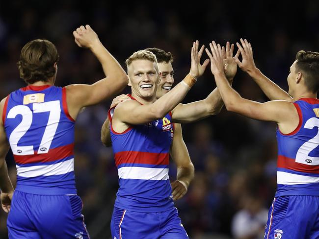 Adam Treloar of the Bulldogs celebrates a goal.