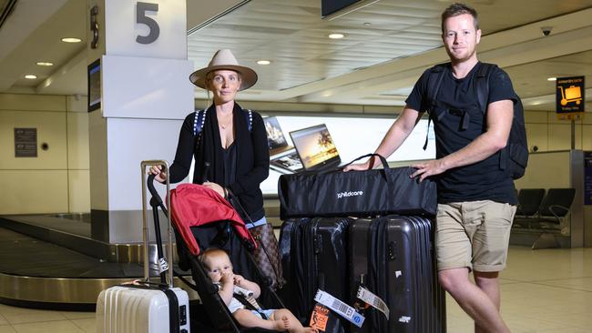 Scott and Annie Harris of Jamberoo with their son Edward, 9 months at Sydney Domestic Airport after a Jetstar flight from Cairns. Picture: Darren Leigh Roberts