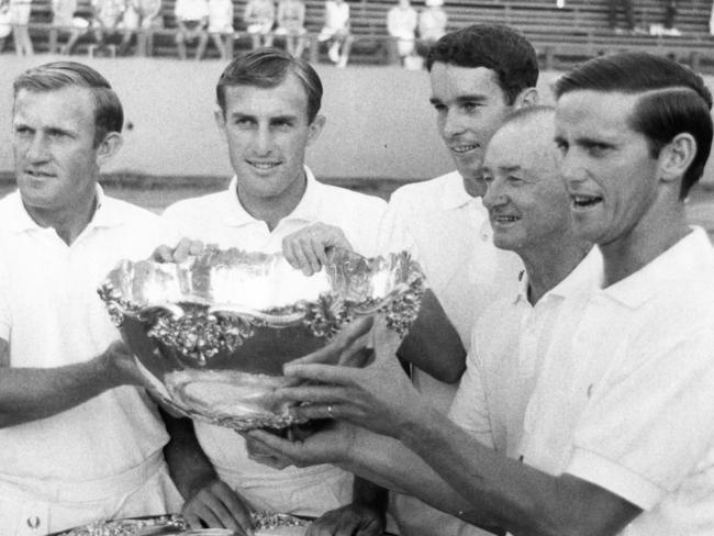 The champion Australian Davis Cup team in 1967: From left: Tony Roche, John Newcombe, Bill Bowrey, Harry Hopman (captain) and Roy Emerson. Picture: Courier Mail