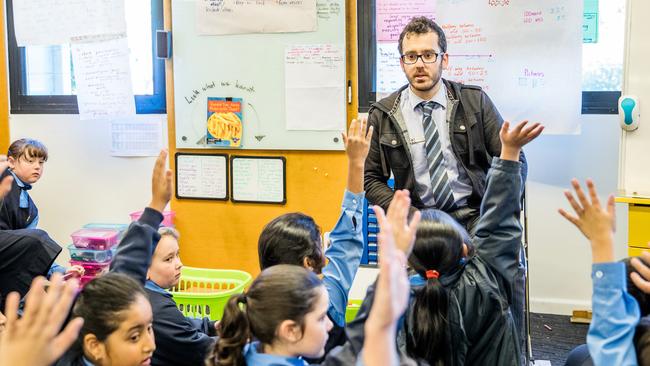 A rare male primary school teacher in the classroom.