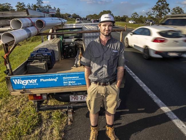 22nd November 2019.Caboolture plumber Ross Baker parked on the M1 in Caboolture. Photo: Glenn Hunt / The Australian