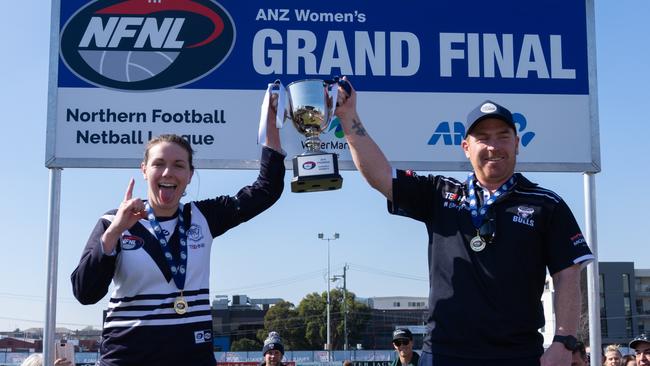 Bundoora NFLW coach Gary Moorcroft gets his hands on another premiership trophy. Picture: Nathan McNeill.