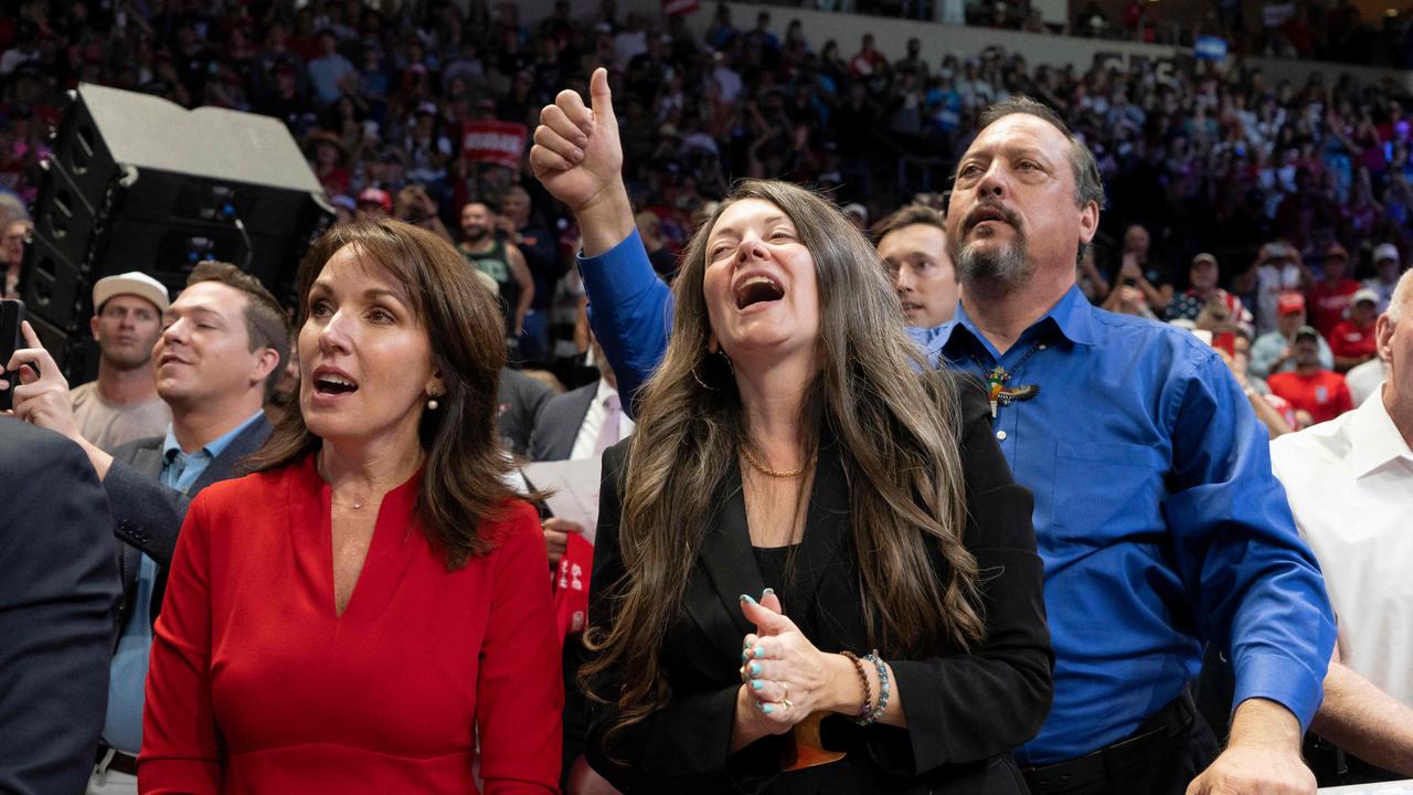 Moms for Liberty co-founder Tina Descovich (left) and Arizona GOP Chair Gina Swoboda (centre) cheer during the campaign rally. Picture: Rebecca Noble/Getty Images