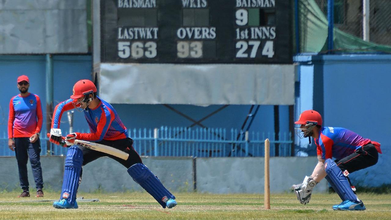 Afghanistan's national cricket team players attend a training session at the Kabul International Cricket Ground. Photo by HOSHANG HASHIMI / AFP