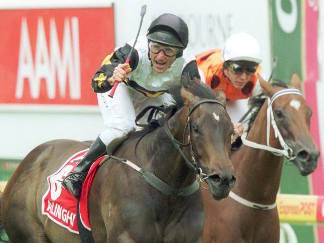 Damien Oliver salutes the crowd after winning the Blue Diamond on Alinghi from Chris Munce on Wager at Caulfield.