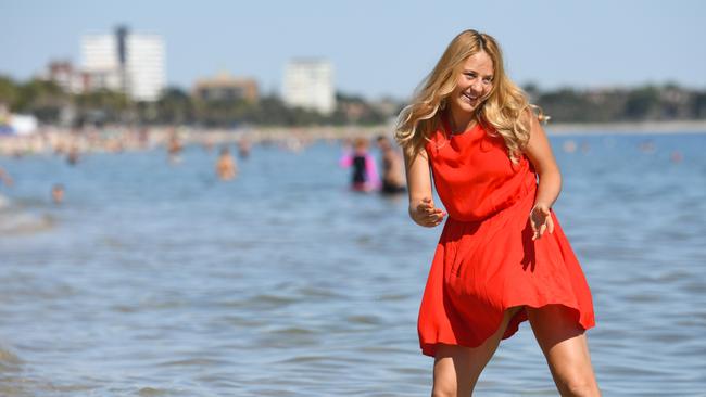 Marta Kostyuk hams it up for the cameras at St Kilda beach yesterday. Photo: Getty Images