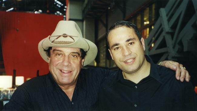 Dimitri de Angelis with Molly Meldrum. Angelis is a convicted conman who has had his photo taken with lots of celebrities when he was a sham music producer.