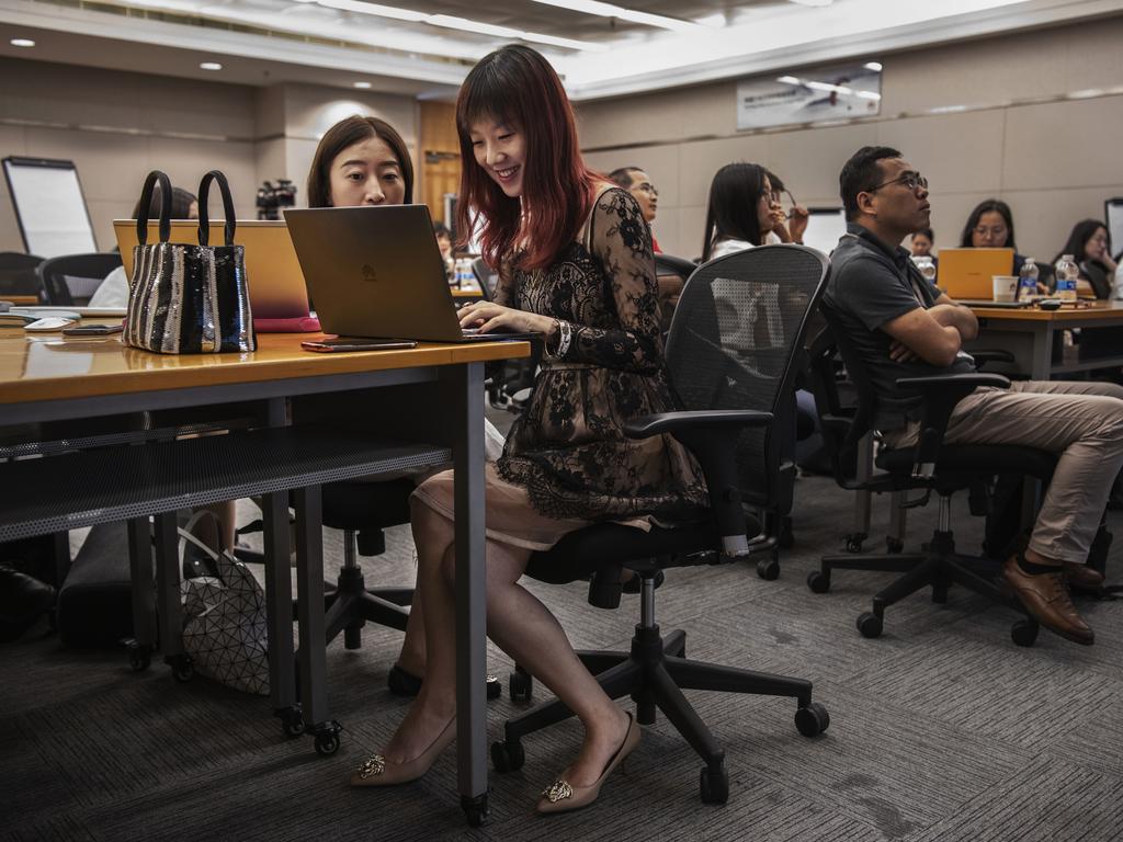 Huawei workers from the Public Affairs and Communications department take part in a training session at Huawei University. Picture: Getty