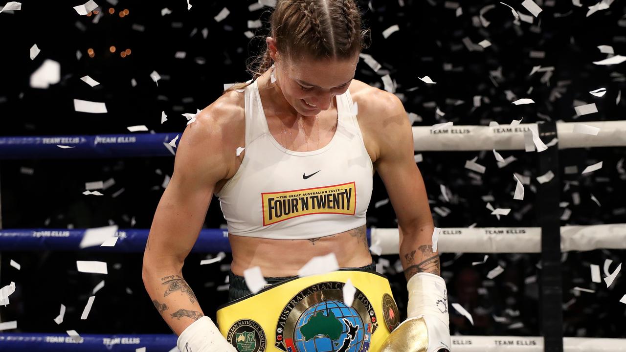 Tayla Harris celebrates with another title belt. Photo by Kelly Defina/Getty Images.