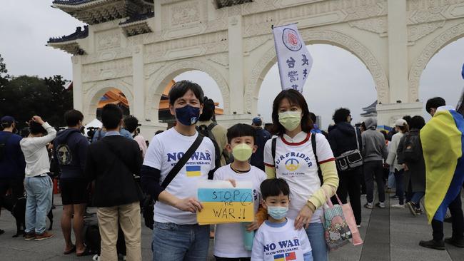 A family showing support for Ukraine at Taipei’s Liberty Square. Picture: Rosaline Walters