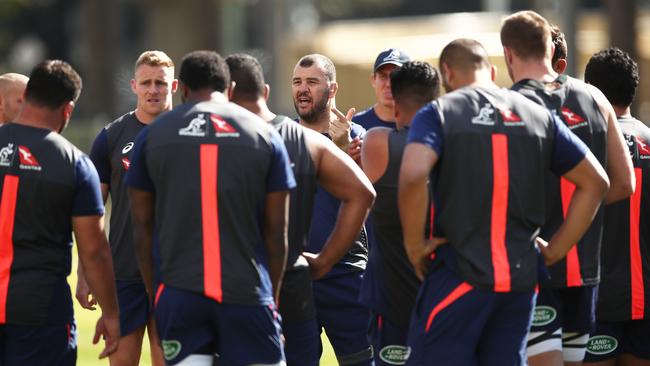 Wallabies coach Michael Cheika talks to his players during training at Moore Park.