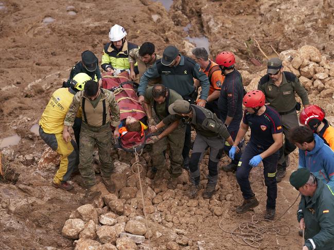 Emergency workers rescue an injured person in Letur, Albacete province, Spain. Picture: Getty Images