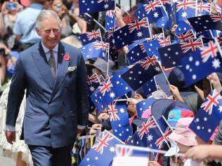ADELAIDE, AUSTRALIA - NOVEMBER 07:  Schoolchildren wave Australian flags as Prince Charles, Prince of Wales visits Kilkenny Primary School on November 7, 2012 in Adelaide, Australia. The Royal couple are in Australia on the second leg of a Diamond Jubilee Tour taking in Papua New Guinea, Australia and New Zealand.  (Photo by Chris Jackson/Getty Images)
