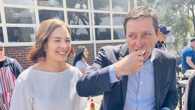 Matthew Guy and his wife Renae at a polling booth in Templestowe on election day on Saturday. Picture: Rebecca Michael