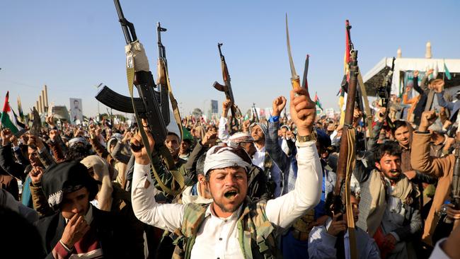 Houthi fighters brandish their weapons during a protest in the Yemen capital Sanaa. Picture: AFP