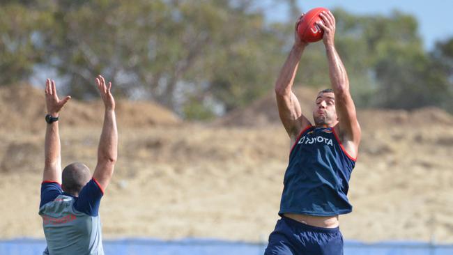 Taylor Walker has some marking practice at Football Park. Picture: AAP Image/Brenton Edwards