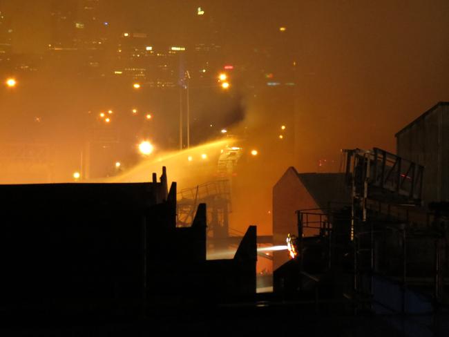 A local resident captures the fire from a nearby apartment tower. Picture: Kiah Doodie