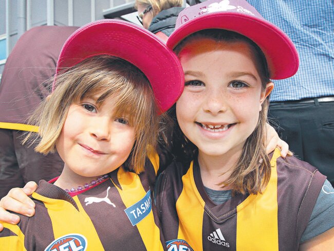 Young Hawk supporters, sisters Lulu, 4, and Sasi Palmer, 7, in Launceston to see the Hawks and the Premiership Cup. Picture: ROSS MARSDEN