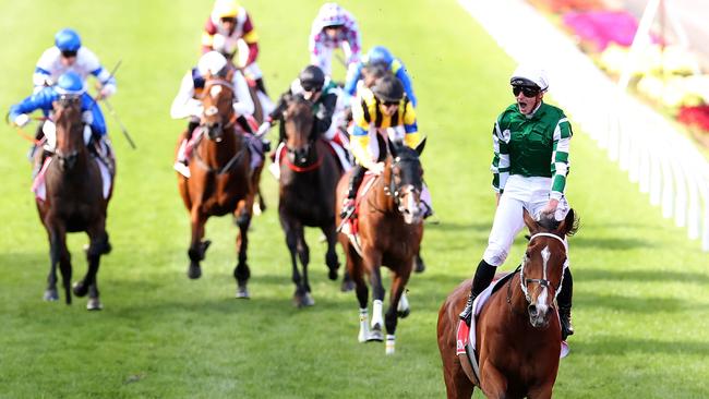 MELBOURNE, AUSTRALIA - OCTOBER 26: James McDonald riding Via Sistina (IRE) celebrates winning the Ladbrokes Cox Plate and his 100th Group 1 race during Cox Plate Day at Moonee Valley Racecourse on October 26, 2024 in Melbourne, Australia. (Photo by Kelly Defina/Getty Images)