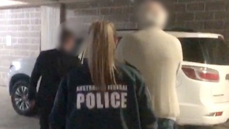 AFP officers arrest Robert Alan Hill, 69, at his Lakemba home last year. Picture: AFP