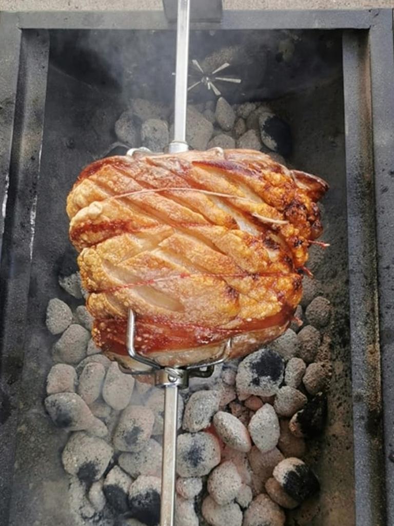 Roast pork shoulder is popular among members. Picture: Facebook/Bunnings $85 Jumbuck Mini Spit Society