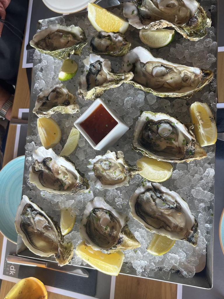 The newlyweds sat down to enjoy some drinks when they were pressured into ordering a dozen oysters at DK Oyster in Mykonos. Picture: Kennedy News and Media