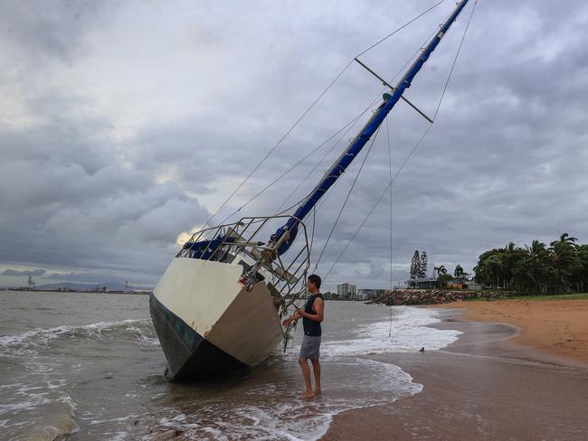 Townsville locals including Dr Deepak Doshi woke early to inspect the damage along The Strand left from TC Kirrily that hit overnight. Pics Adam Head