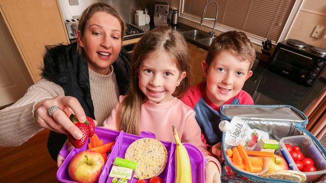 Parents could be advised to swap out junk food for healthier options in their kid’s school lunch boxes. Belinda Kosinski, Ella 7, and Max, 9 with their healthy choices. Picture: Tim Carrafa