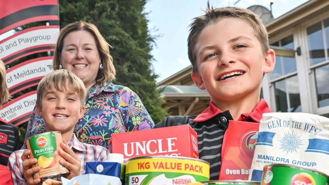 APRIL 16, 2025: Cambrai primary school students Indie Ryan, Felicity Fiebig, Preston Wills, Samuel Nuske, Principal Leila Kasprzak and Darren Fiebig with a food hamper. The school received an Advertiser Foundation Drought Grant to operate a community pantry to create and buy hampers to support 15 families during term. Picture: Brenton Edwards