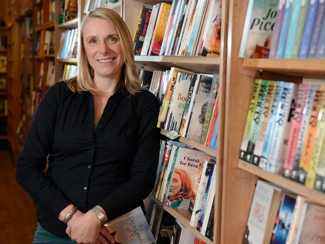 Robinsons Bookshoip owner Susanne Horman at the flagship Frankston book shop, which has since expanded to have shops in Chadstone, Greensborough and now Emporium. Susanne pictured with their 'Blind Date with a Book' books. One of the successful things the shop does is pick new releases, wrap them up and describe the book in three words so the customer is buying it 'blind'. Picture: Jason SammonTuesday 23rd September 2014