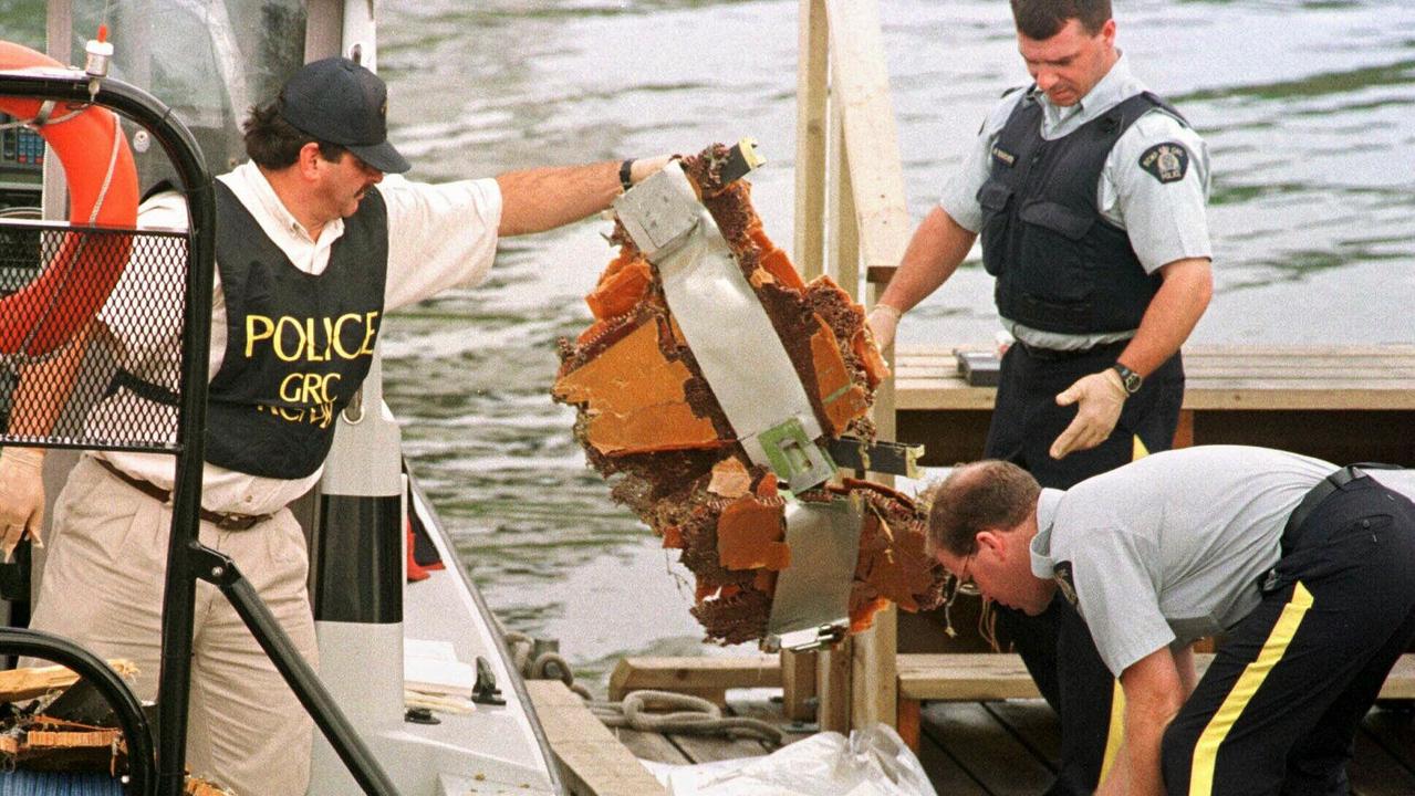 Canadian police sort through debris from the wreckage. Picture: AP