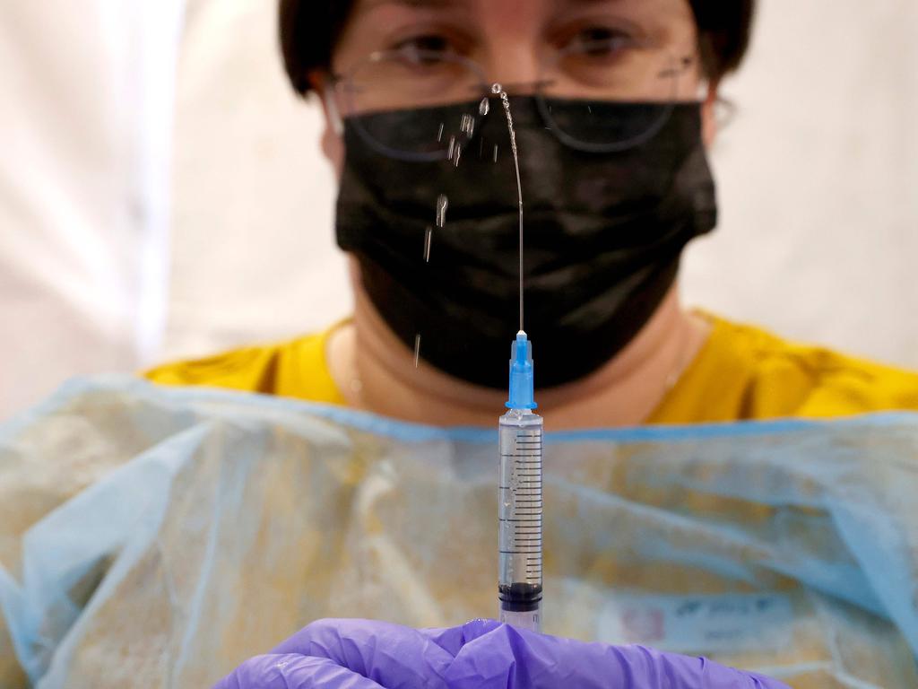 A healthcare worker prepares a dose of the Pfizer vaccine in Tel Aviv. Picture: AFP