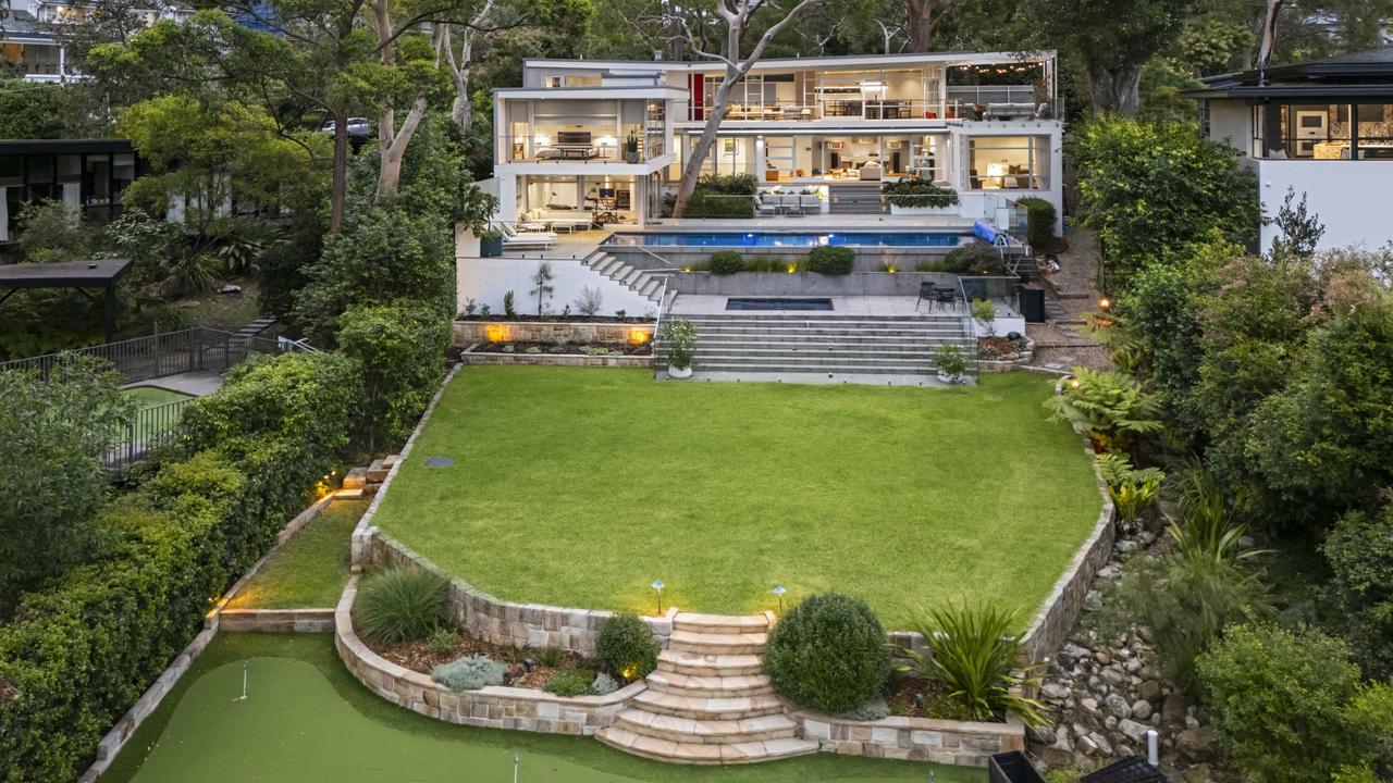 A pool, lawn and decks give it the feel of a grand lifestyle resort.