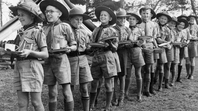 Scouts parade for dinner during a woodcraft camp in Morphettville, 1946.