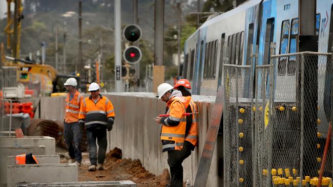 Workers on site during level crossing removal in Melbourne.