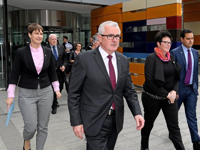 Andrew Andrew Wilkie (centre) and director of Rainbow Families Victoria Felicity Marlowe (second right) leave the High Court today. Picture: AAP