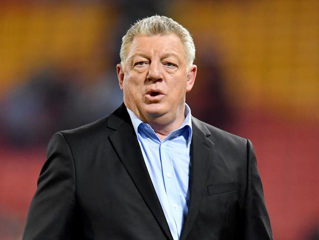 Television commentator Phil Gould is seen during the Round 22 NRL match between the Brisbane Broncos and the Penrith Panthers at Suncorp Stadium in Brisbane, Friday, August 16, 2019.  (AAP Image/Darren England) NO ARCHIVING, EDITORIAL USE ONLY