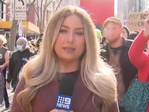 Channel 9 reporter Lana Murphy reporting from a pro-abortion rally in Melbourne on Saturday, July 2, 2022. Source: Nine News