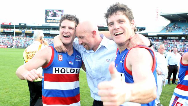 Former Bulldogs coach Roy Laird with Chris (left) and James Gowans after Central District’s grand final win over Norwood.